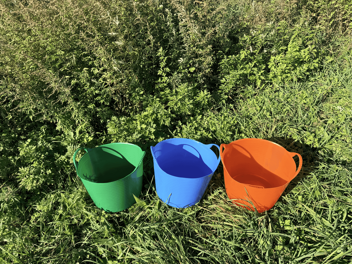 Red Gorilla 6.9-gallon garden tub shown with sturdy plastic container for gardening and plant watering tasks.
